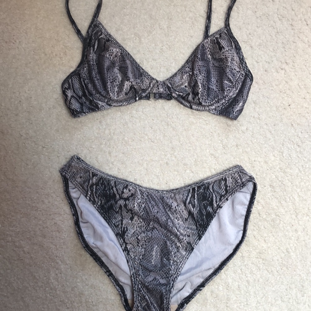 Blikini,sexy black and silver with shiny grey size small . Has underwire bra.